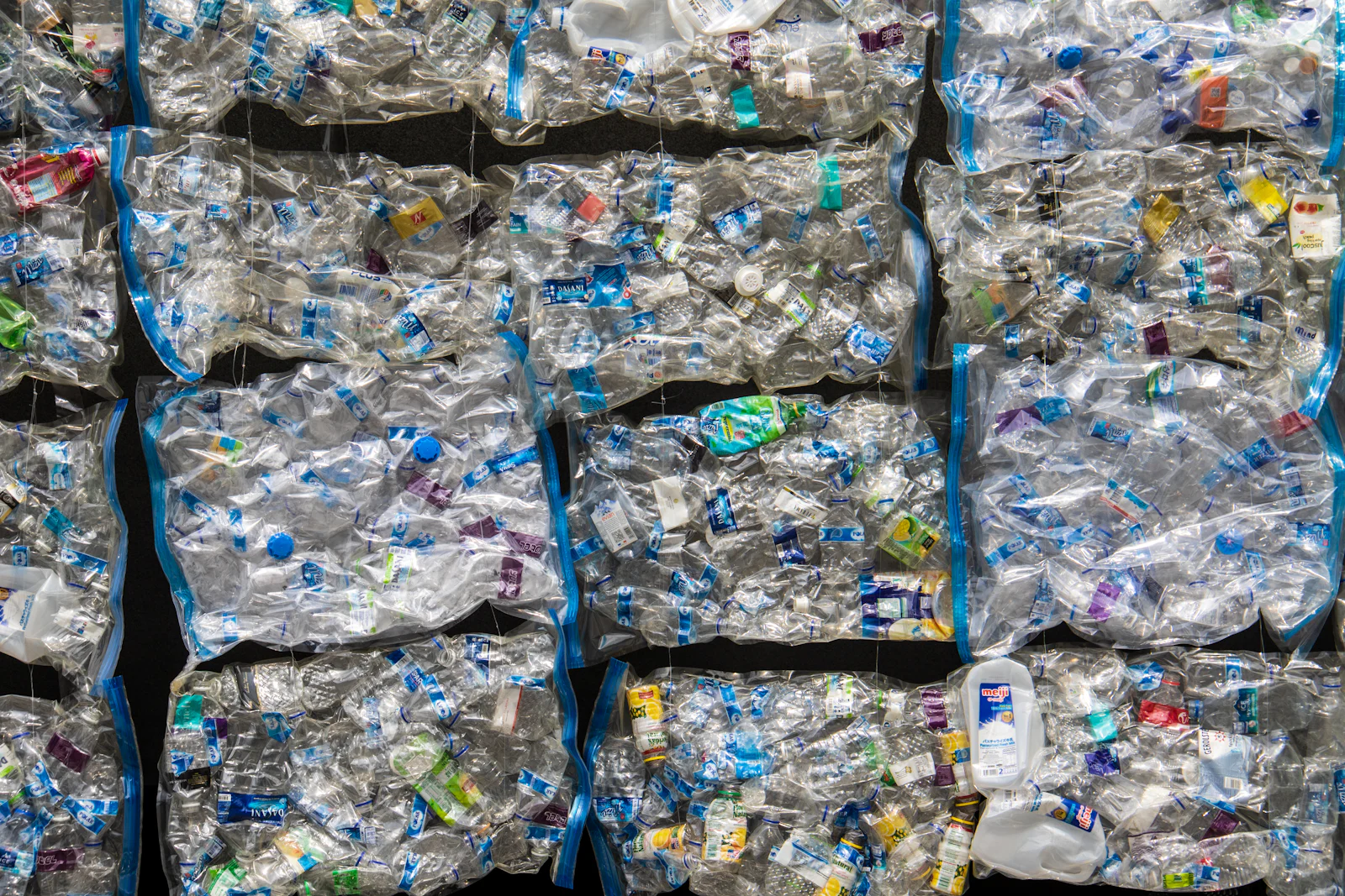 Compressed bales of recovered plastic