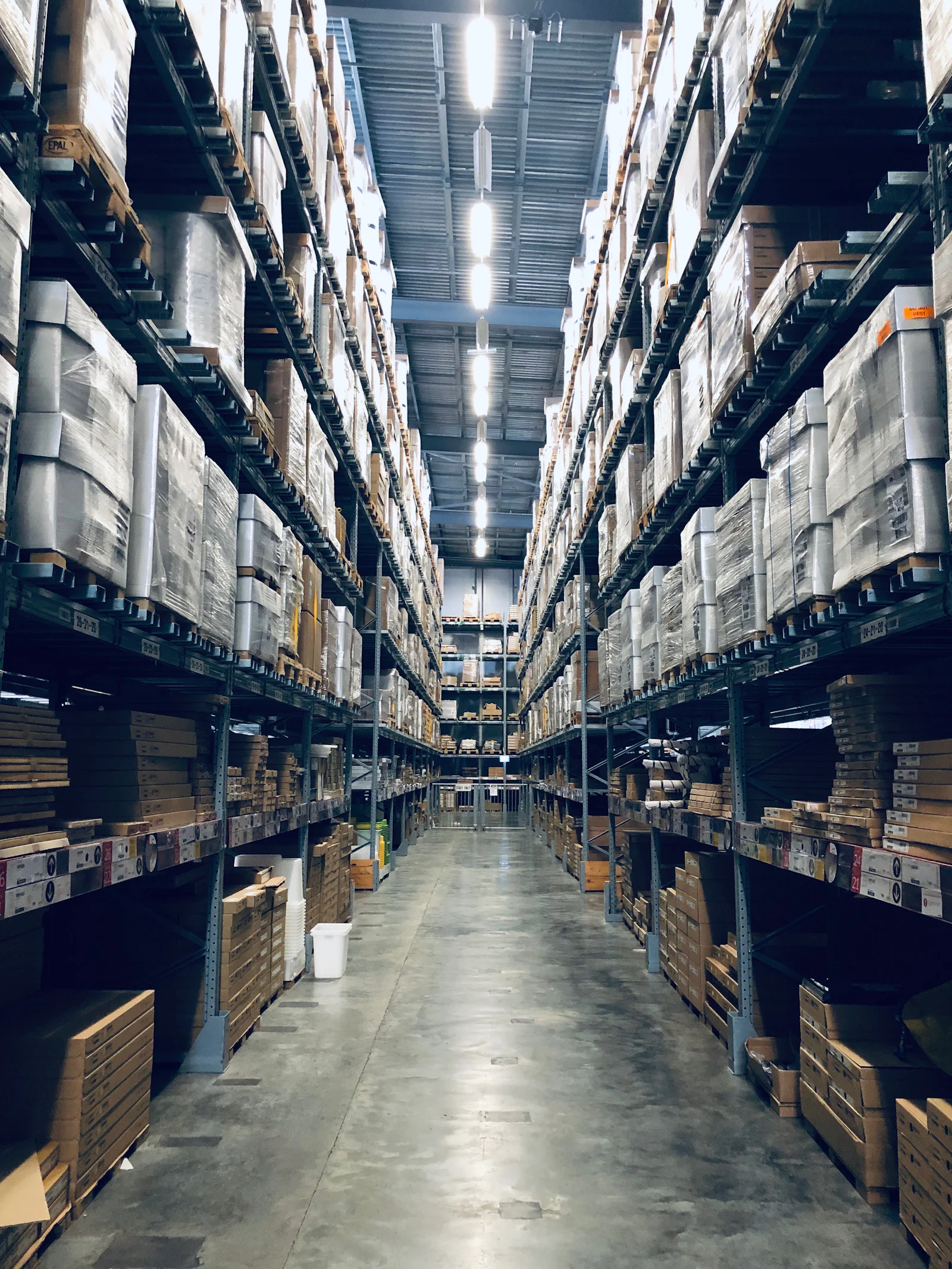 Long warehouse aisle with high racking